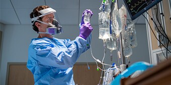 A health care provider using respiratory protection
