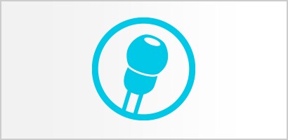 Rundt ikon med en cyan tætsluttende blød øreoliven på et Littmann stetoskop.
