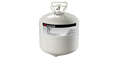 Opløsningsmiddel- og vandbaseret lim bruger en flydende bærer til at påføre klæbestoffet på overfladerne. Billede af spraylim i en cylinder.
